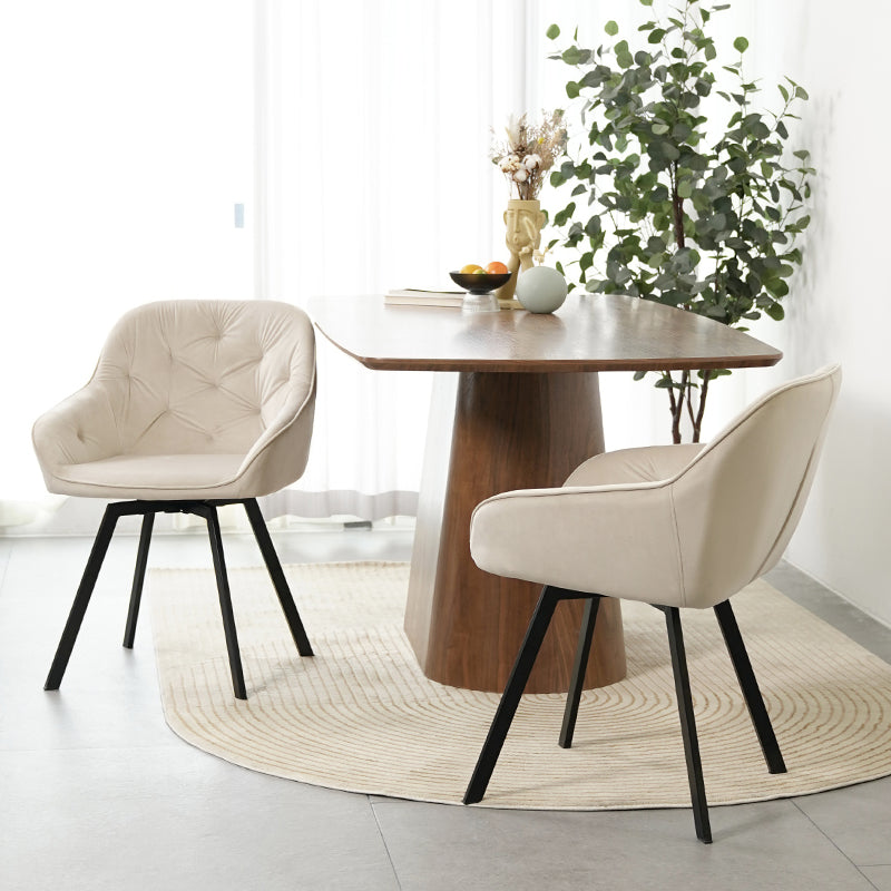 Silla giratoria moderna Keaton de OFCASA en color negro con asiento acolchado de polipiel y patas de metal cromado, mostrando su mecanismo de giro de 360°