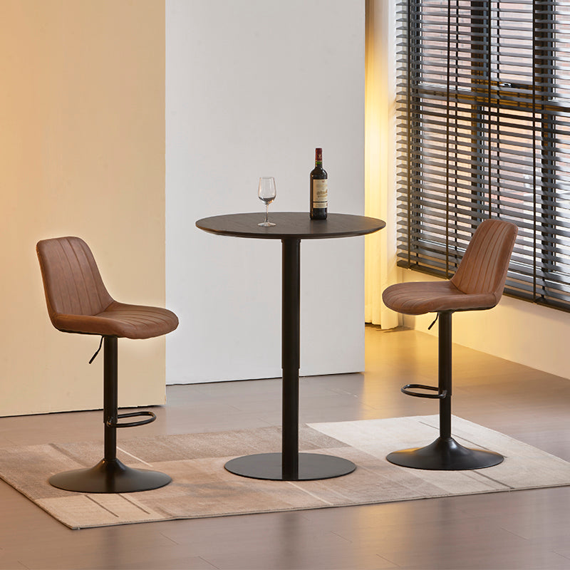 Taburete de barra Jarvis AJ en PU negro, altura regulable 62-82 cm con mecanismo hidráulico y giro 360°