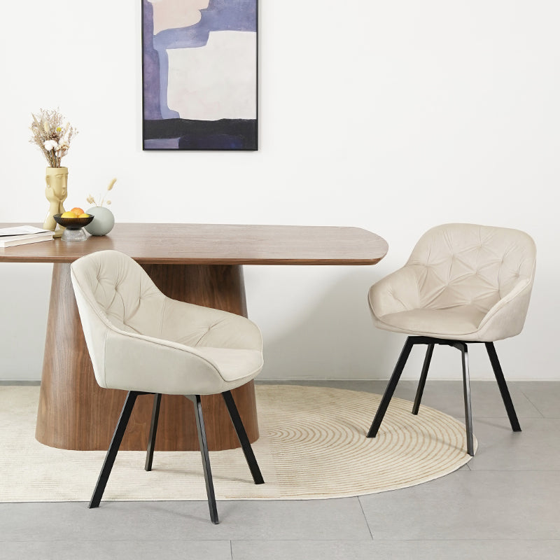 Silla giratoria moderna Keaton de OFCASA en color negro con asiento acolchado de polipiel y patas de metal cromado, mostrando su mecanismo de giro de 360°